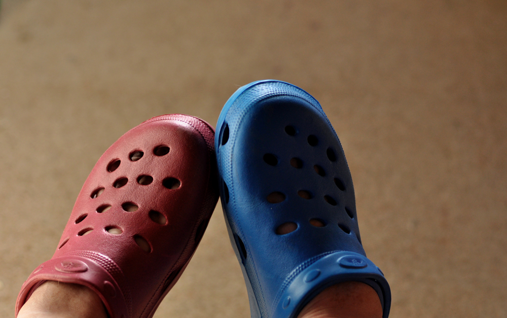 blue and yellow mismatched crocs
